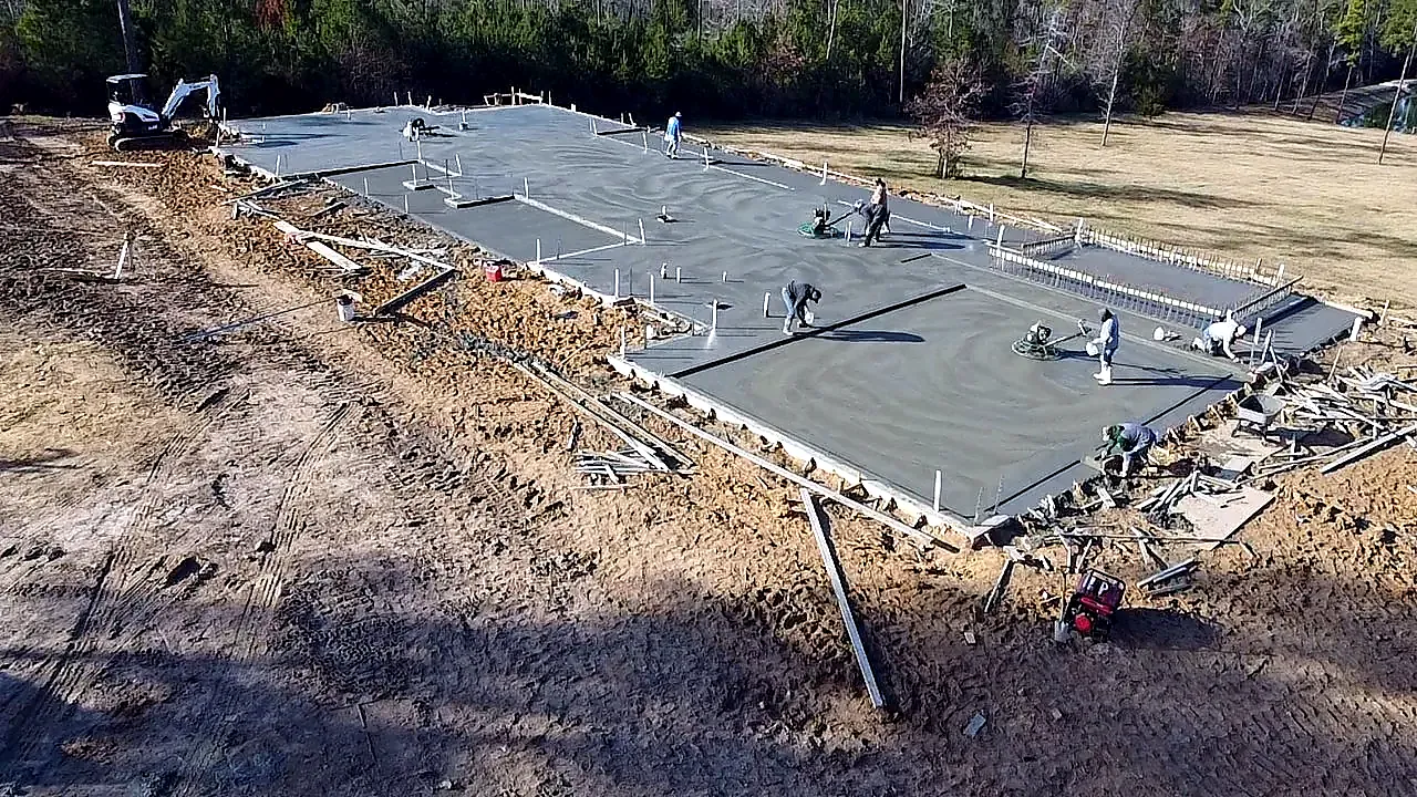 JP Concrete Solutions crew finishing a freshly poured slab on pour day